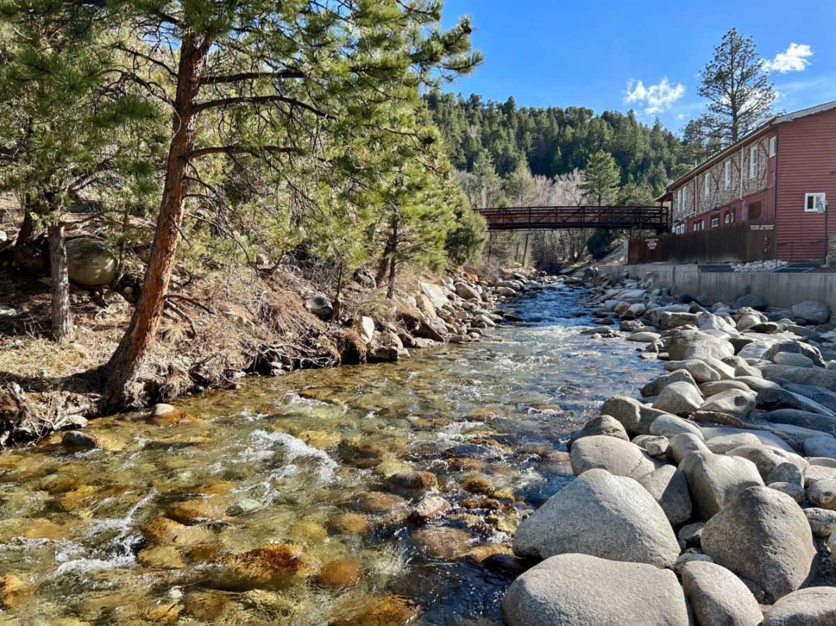 A bridge over the creekside pool in Mt. Princeton Hot Springs Resort