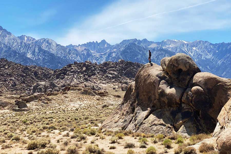 View of a man on top of Mt. Whitney