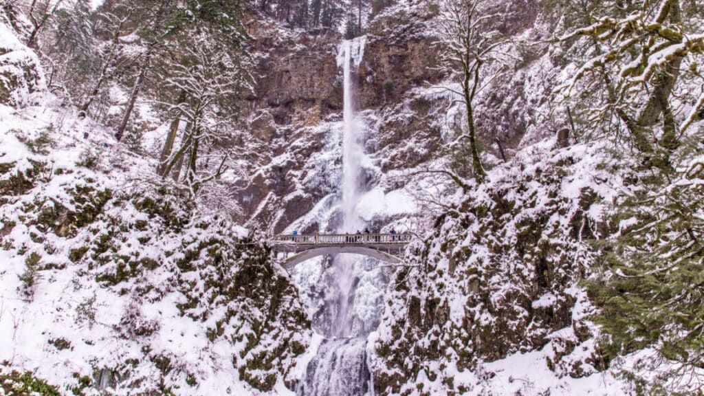 Scenic view of the bridge and the magnificent Multnomah Falls in the background during winter