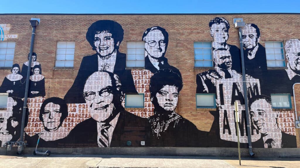 Clear blue sky over a mural on a building