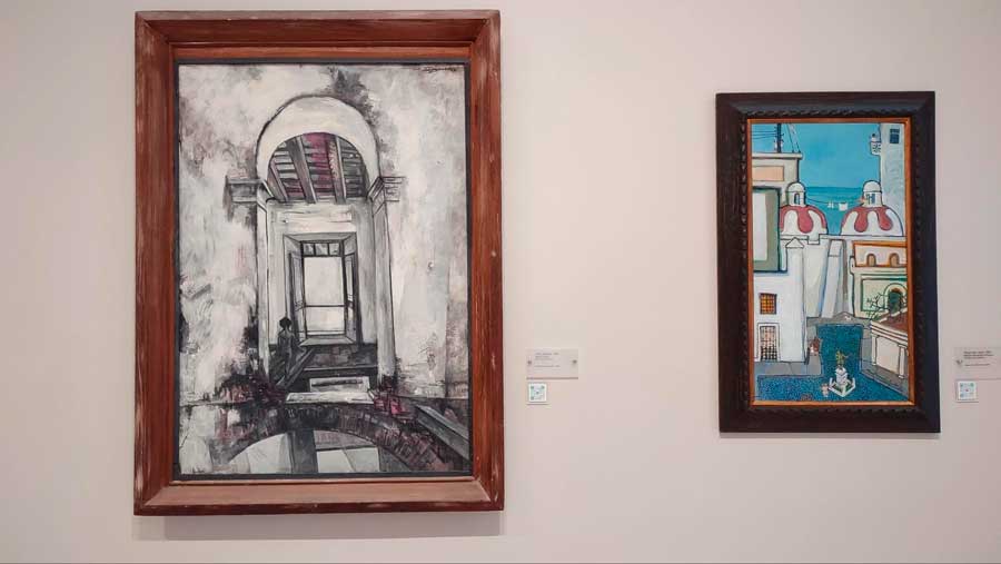 Paintings displayed on a wall inside Mused de Arte de Bayamon
