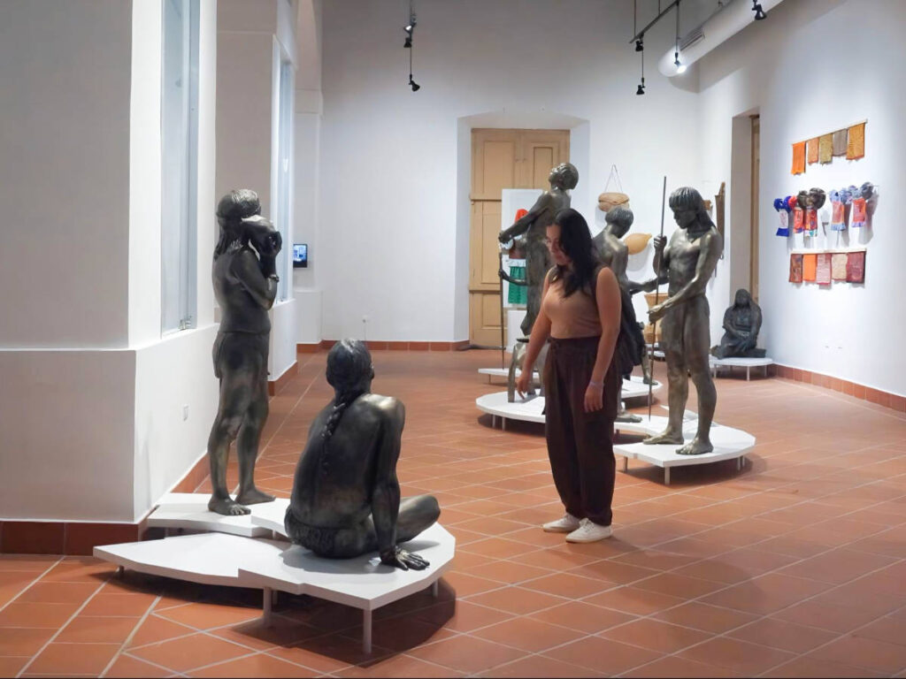 The author Vanessa Ramos looking at one of the displays inside Museo de las Américas