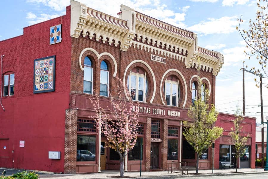View of the red exterior of a museum in downtown Ellensburg