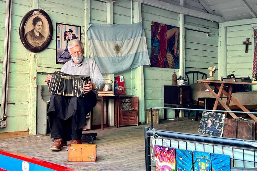 A musician playing his instrument in La Boca