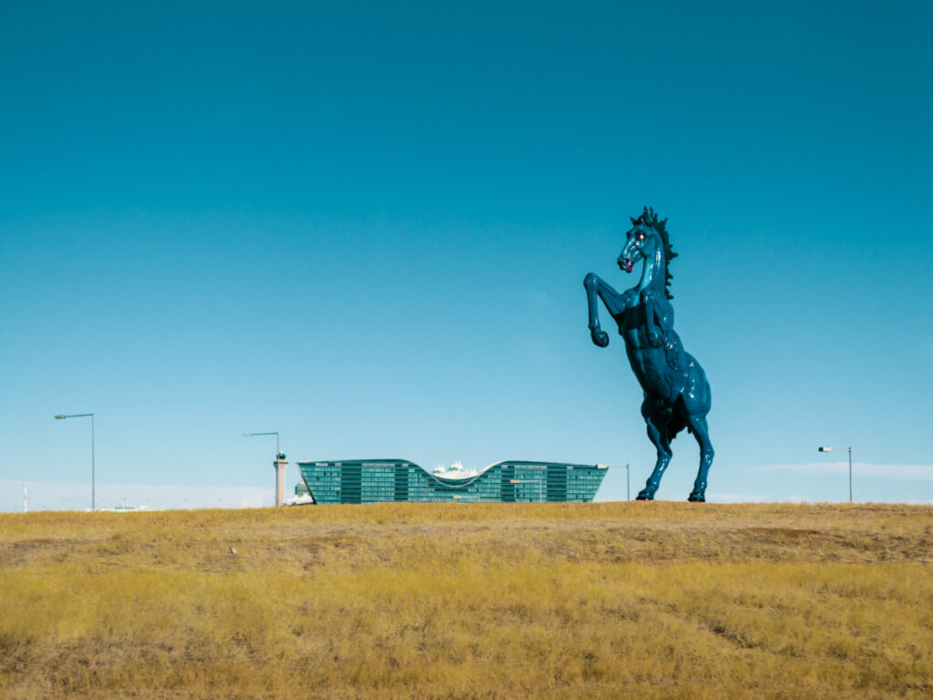 A blue horse statue in Denver, known as Mustang