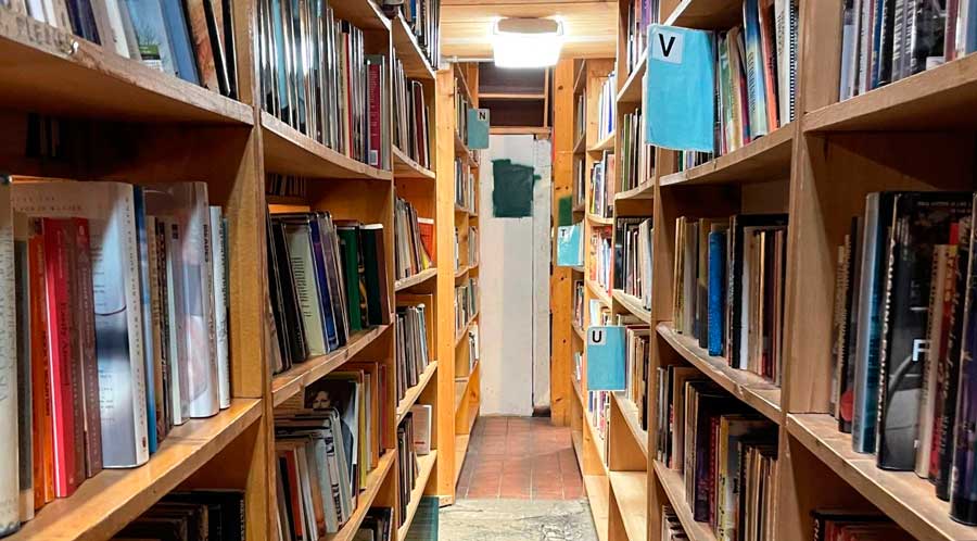 View from an isle of bookshelf in Myopic Books