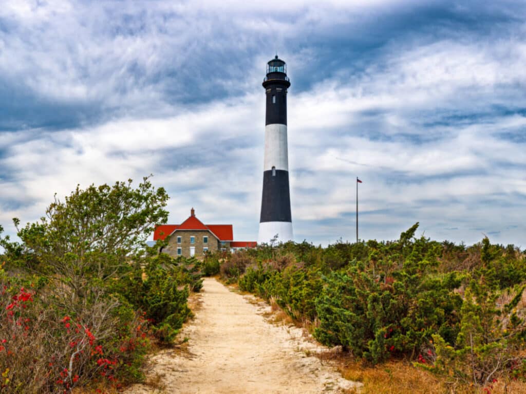 Panoramic view of the Fire Island Lighthouse with the cloudy sky in the background