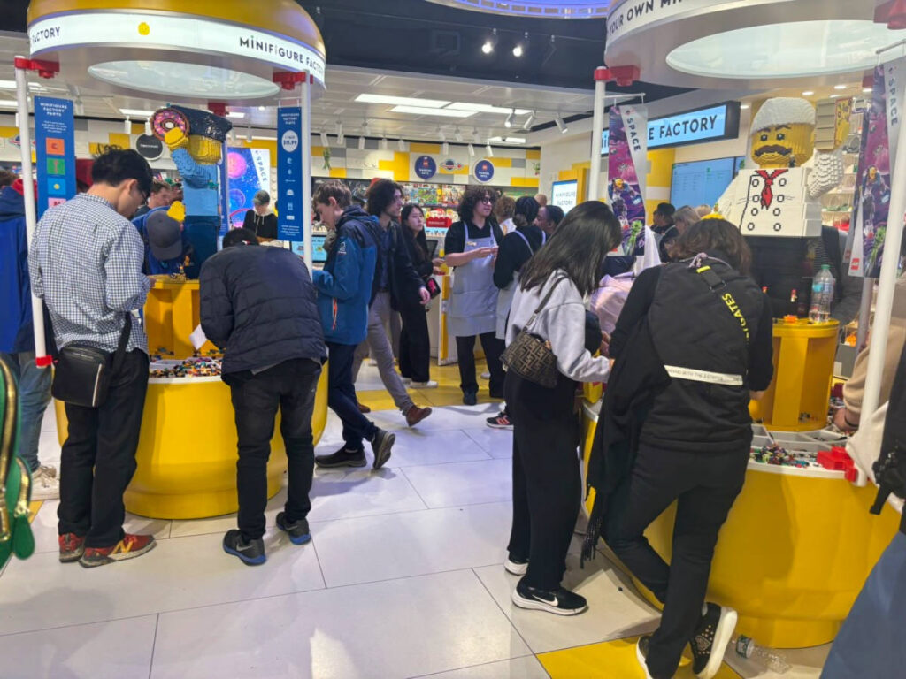 People playing with Legos at the NYC Lego Store