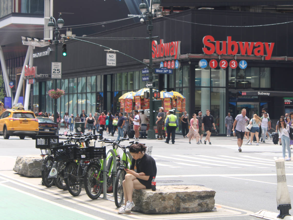 View of the entrance to the subway in NYC seen from across the street