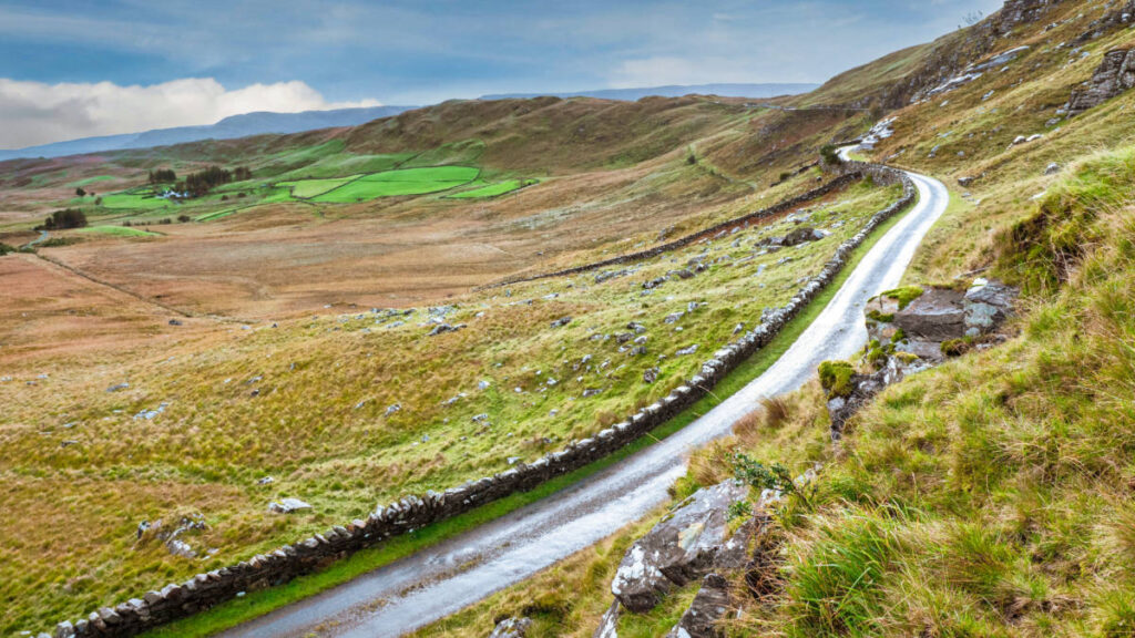 View of the narrow country road near the hills