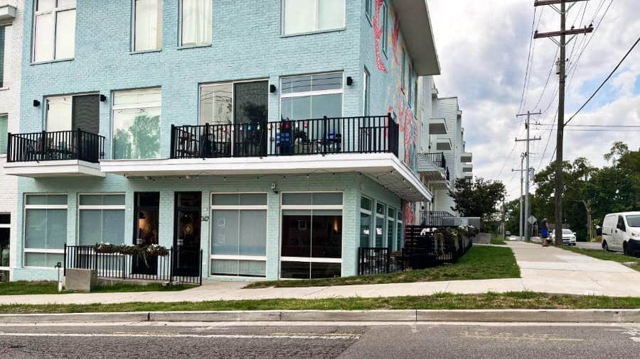 A light blue exterior building on an empty street in Nashville