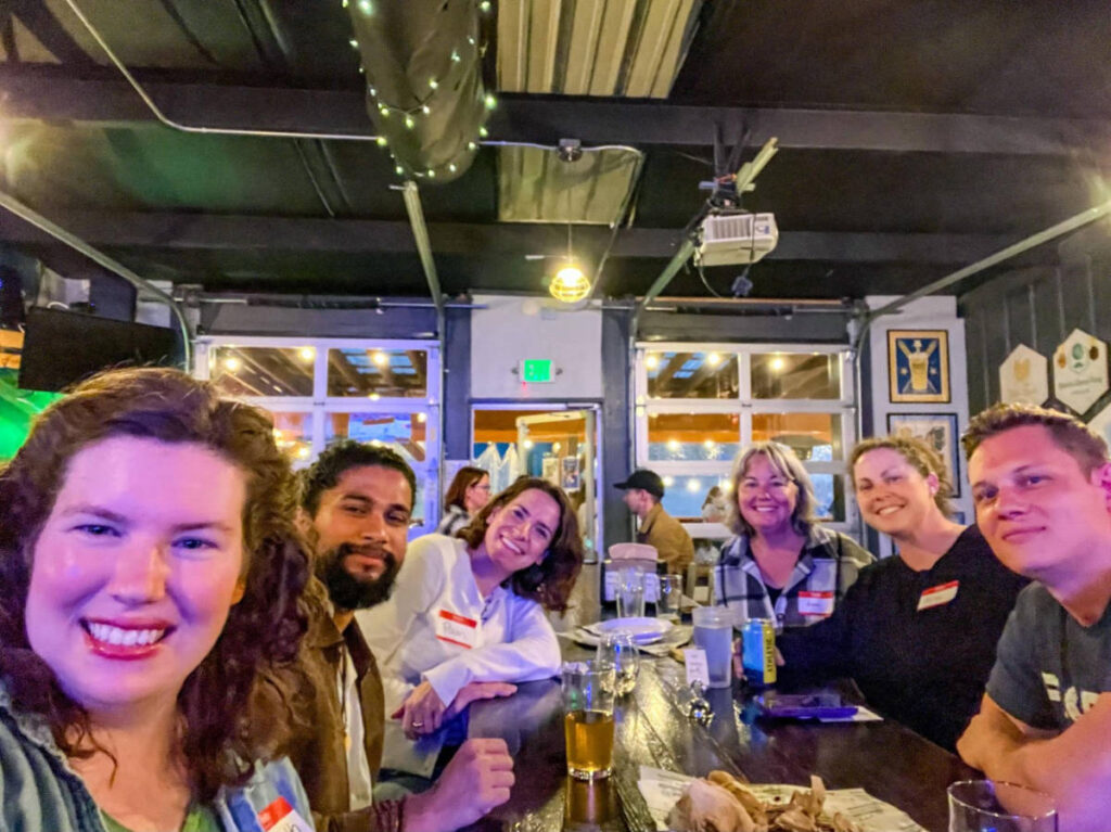 People smiling for a photo during the Travel Lemming's Nashville Community Meetups
