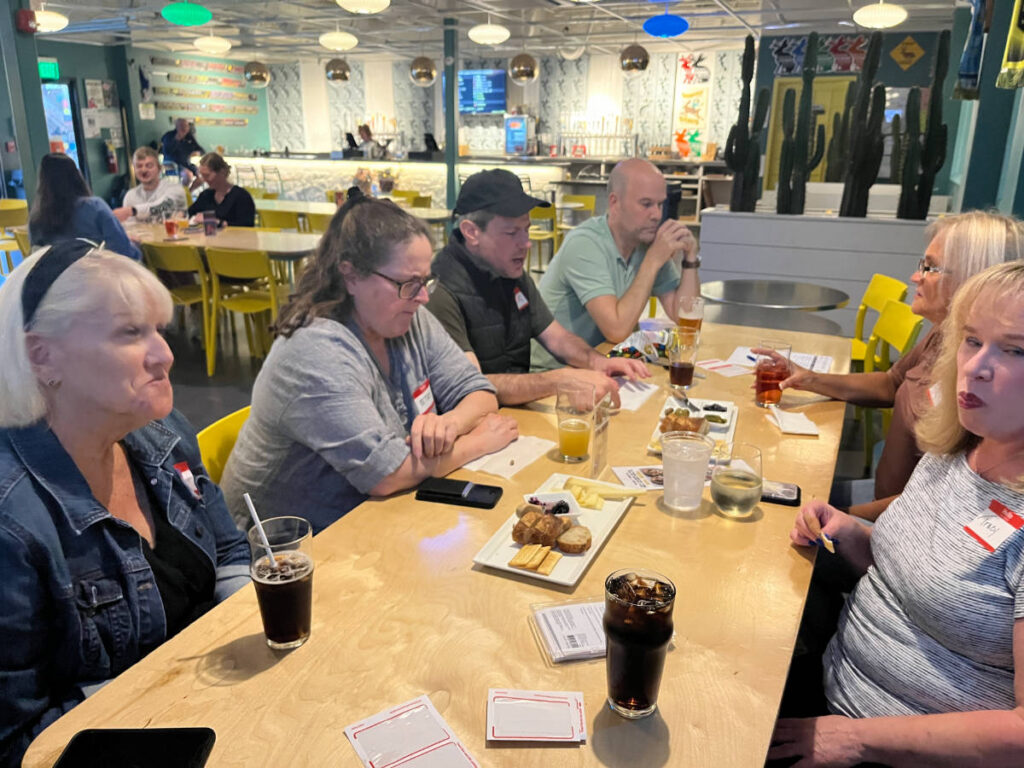 People sharing their travel stories during the Travel Lemming's Nashville Community Meetups