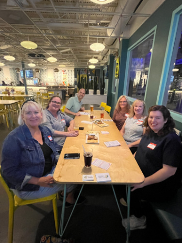 People smiling for a photo during the Travel Lemming's Nashville Community Meetups