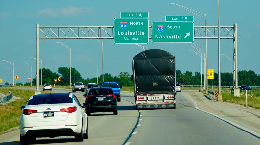 Cars passing by the road sign in Nashville