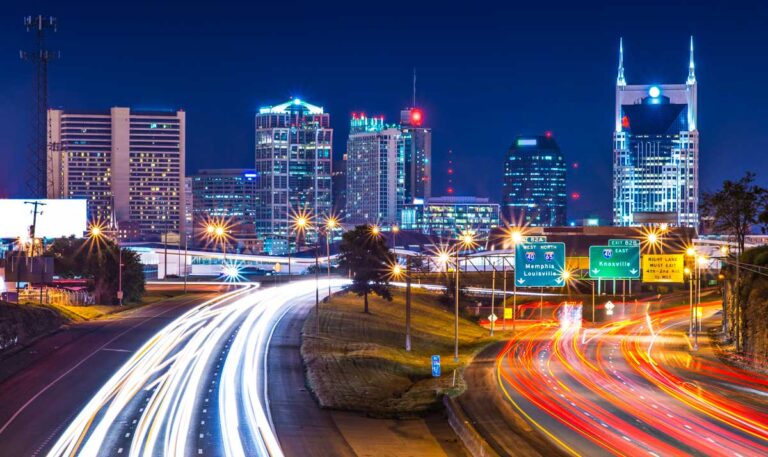 Overlooking view of the street and skyscrapers in Nashville at night
