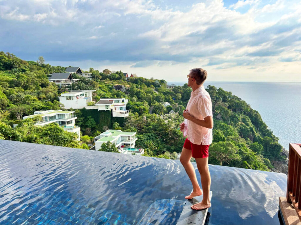 Travel Lemming founder Nate Hake admiring the overlooking view from the poolside of Paresa Resort Phuket