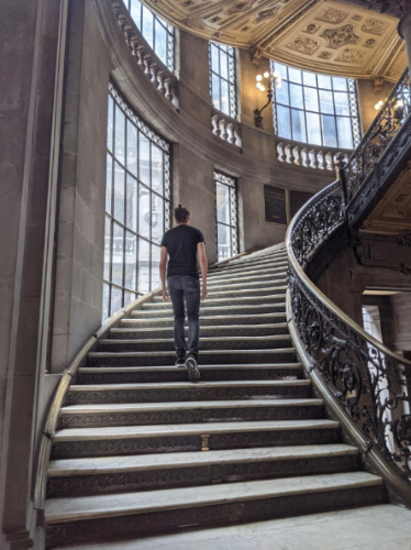 Travel Lemming founder Nate Hake, climbing the beautiful staircase of Museo Nacional De Arte