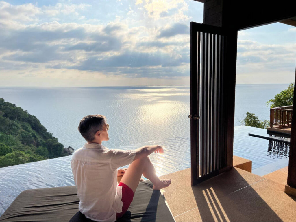 The author, Nate Hake admiring the view from a hotel with infinity pool
