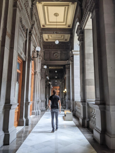 Travel Lemming founder Nate Hake, walking along the corridor of Museo Nacional De Arte
