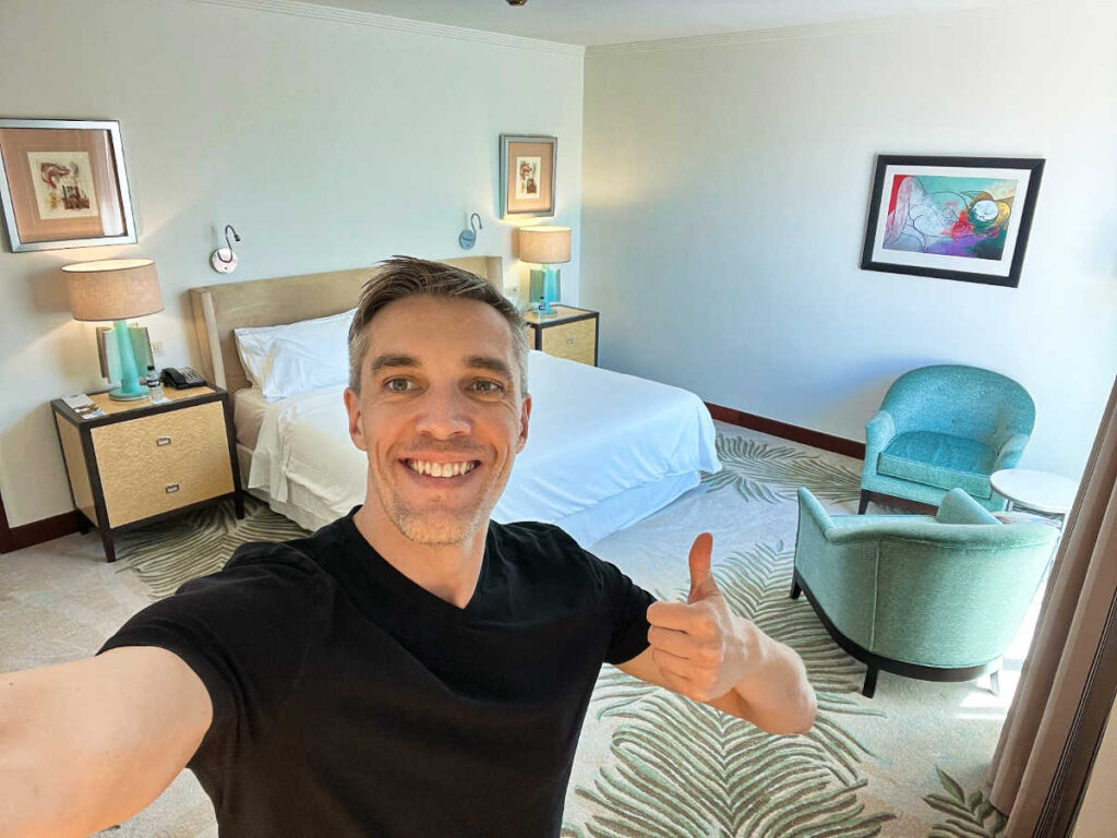 Travel Lemming's Founder Nate Hake, posing with a thumbs up inside the suite at The Westin