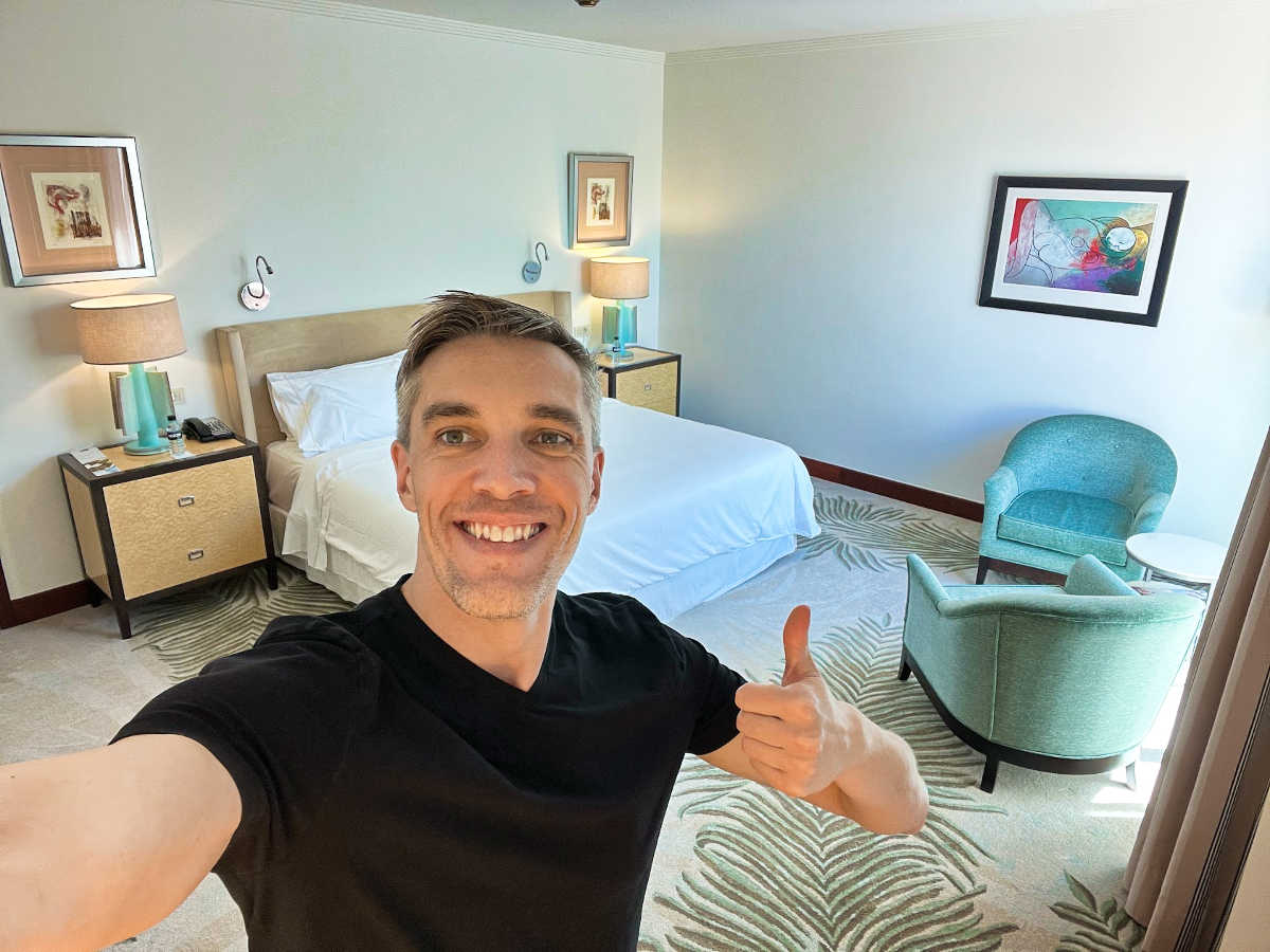 Travel Lemming's Founder Nate Hake, posing with a thumbs up inside the suite at The Westin