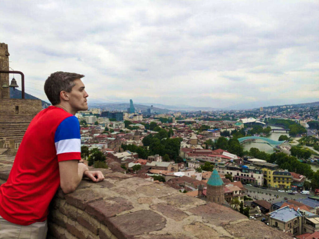 Travel Lemming founder Nate Hake overlooking the city of Tbilisi from Narikala Fortress