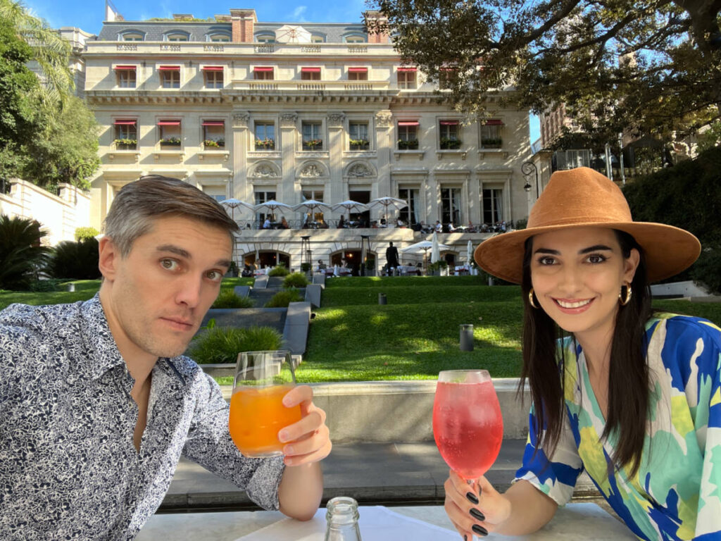 Travel Lemming Founder Nate Hake and Clara Kessler, enjoying their drinks at a courtyard in Buenos Aires