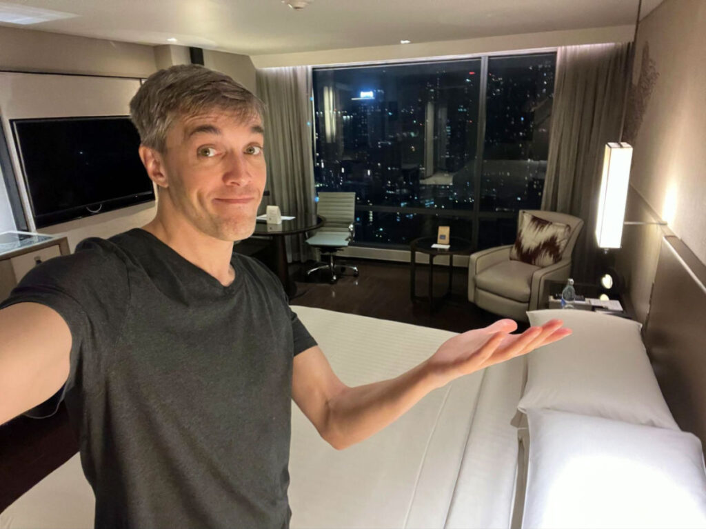 Author Nate showing one of the bedroom at Marriott Marquis Queens Park