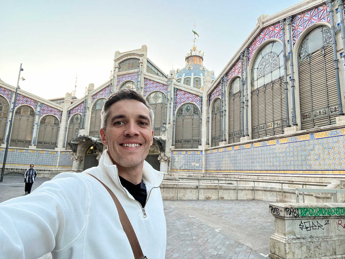 Travel Lemming's Founder Nate Hake, posing in front of the Mercat Central de València in Old Town