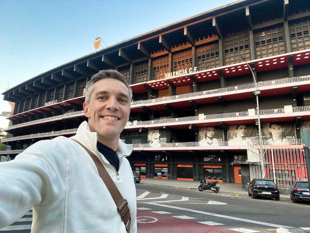 Travel Lemming's Founder Nate Hake, posing in front of Mestalla Stadium