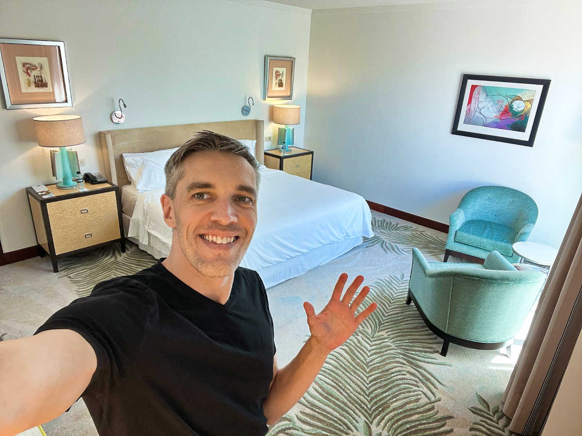 Travel Lemming's Founder Nate Hake, showing off inside the room of The Westin Valencia