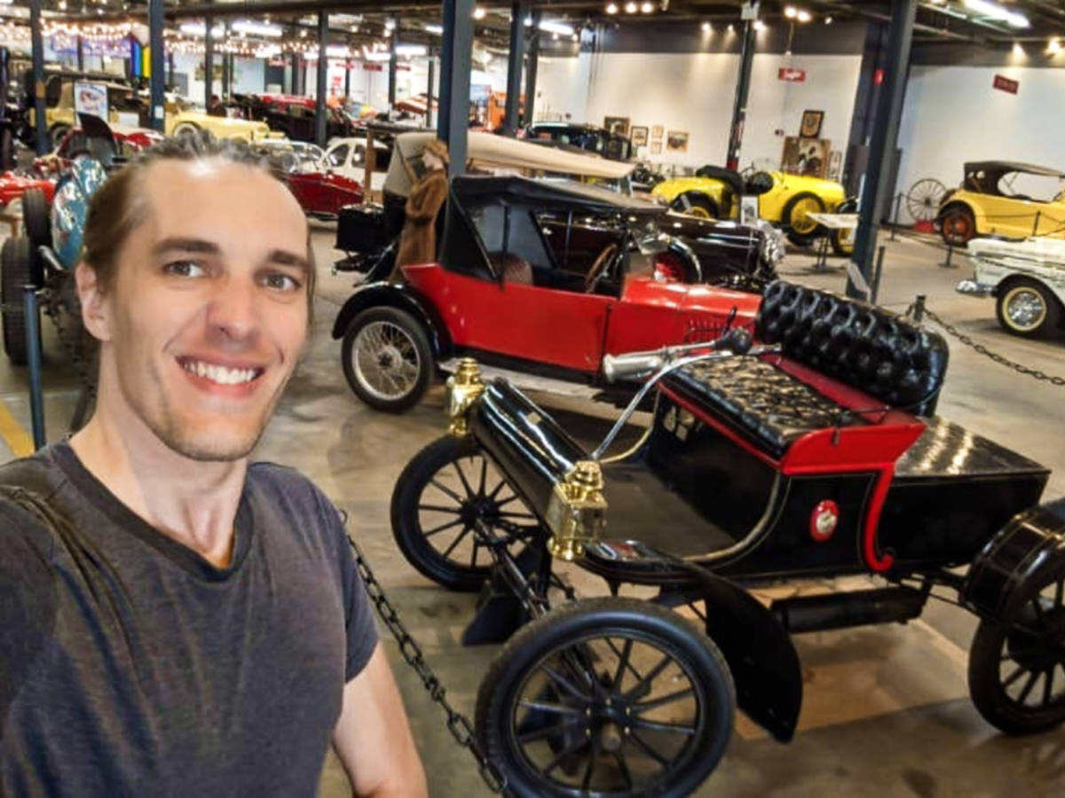 Travel Lemming founder Nate Hake, smiling for a photo inside the Forney Museum of Transportation