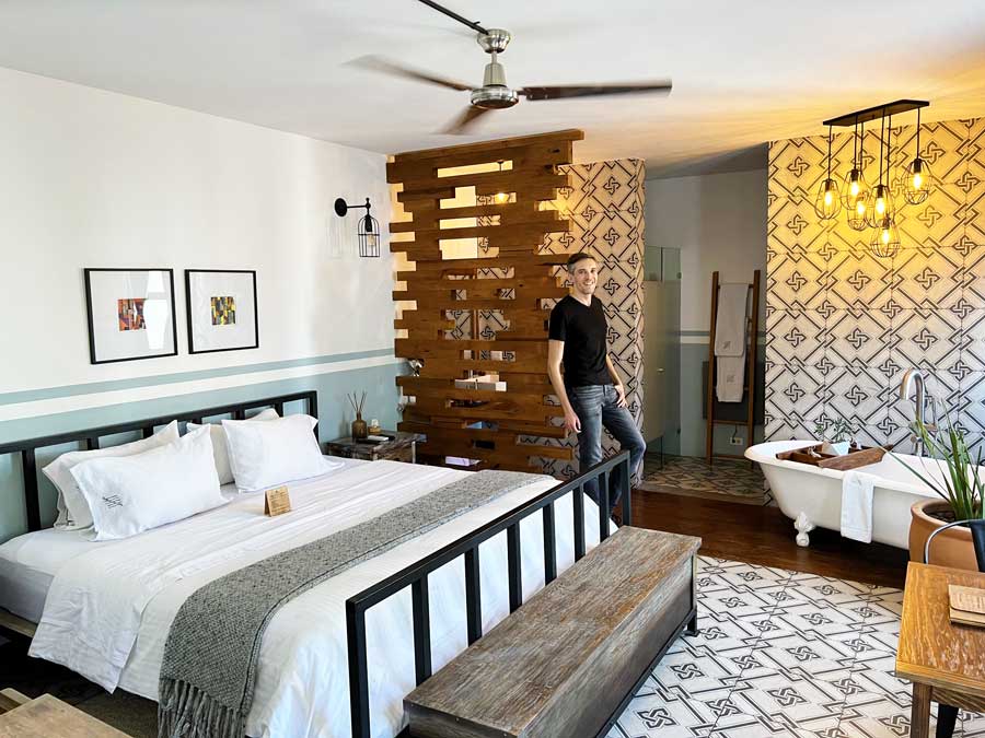 Nate standing on a bedroom in Clandestino Hotel Recreo