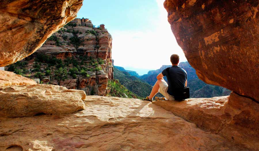 Travel Lemming founder Nate Hake sitting with canyon views