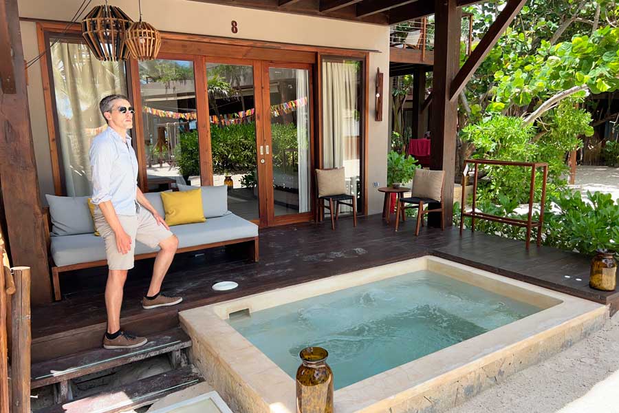 Nate posing for a photo near a jacuzzi in La Zebra