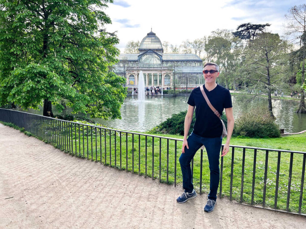 Travel Lemming founder Nate Hake in front of Palacio de Cristal in El Retiro Park