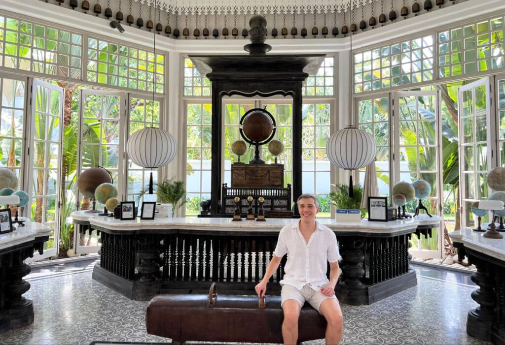 Nate sitting on a pommel horse in the lobby of the hotel