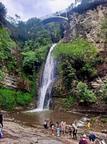 View of the people looking at the waterfall in National Botanical Garden