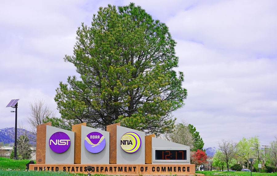 View of the signages in National Oceanic and Atmospheric Administration and a big tree behind it