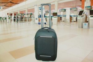 The Nomatic Navigator 37L Carry On Suitcase on an airport