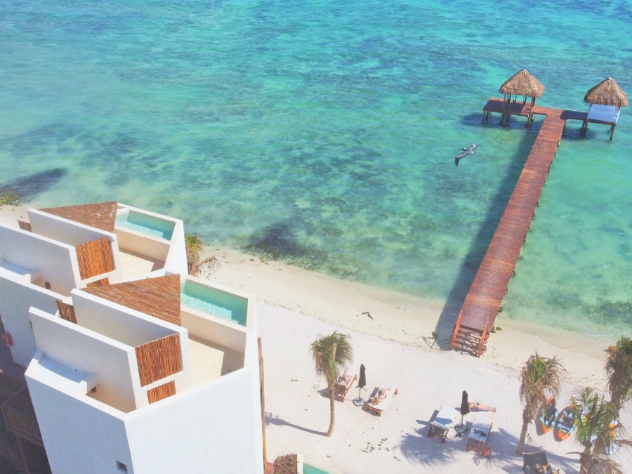 View of rooftop suites with private pools overlooking the ocean at Nerea Tulum hotel