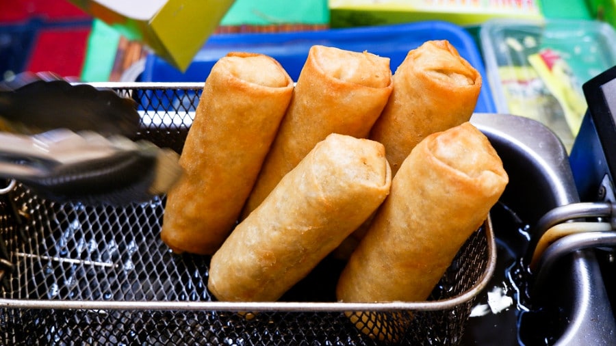 A newly cooked handmade spring rolls fresh from the deep fryer