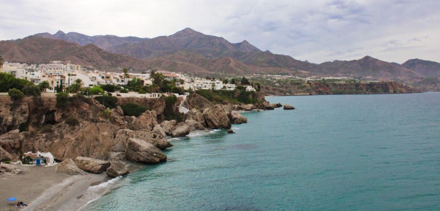 View of a beach paradise with a small town above Nerja.