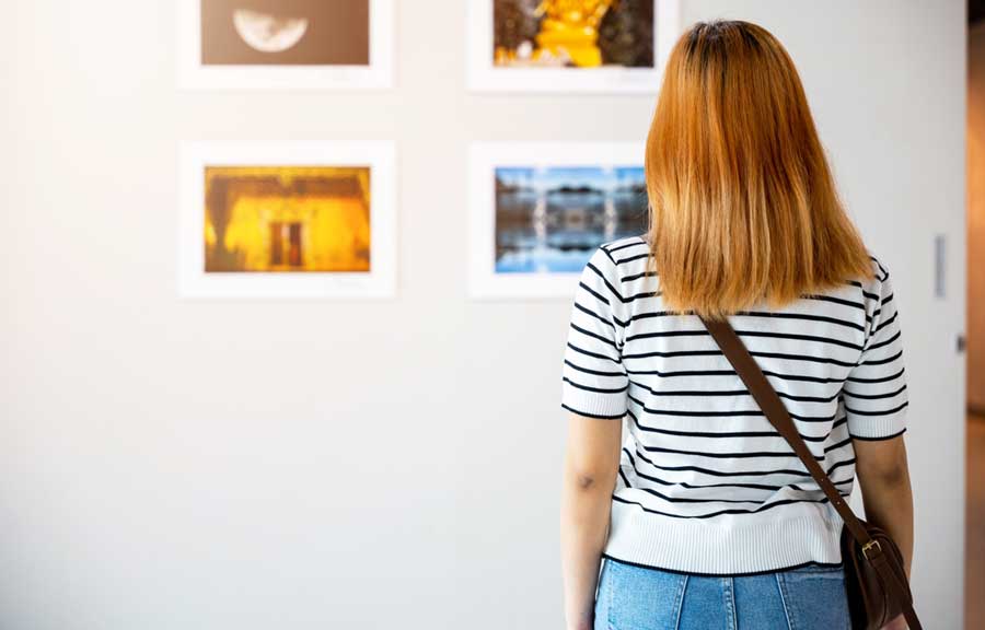 A woman admiring an art in Neuberger Museum of Art