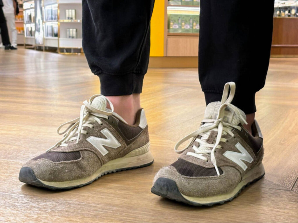 A man wearing New Balance shoes