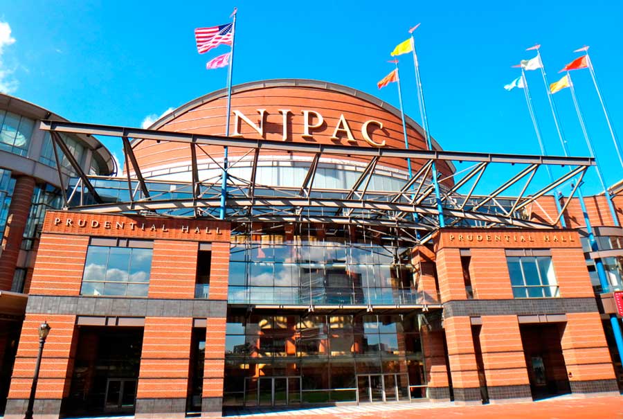 View of the New Jersey Performing Arts Center in Newark from the outside and the clear blue sky over it