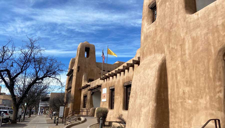 The New Mexico Museum of Art building under the clear blue sky