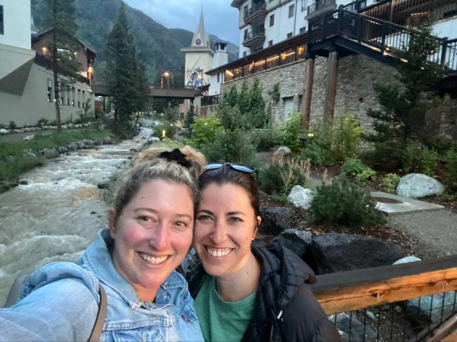 The author with her friend smiling for a photo in Taos Ski Valley