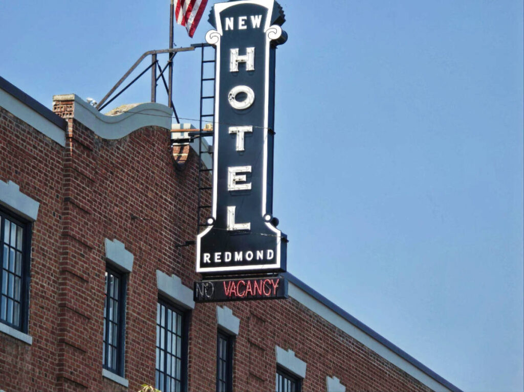 Clear blue sky over the signage of the New Redmond Hotel